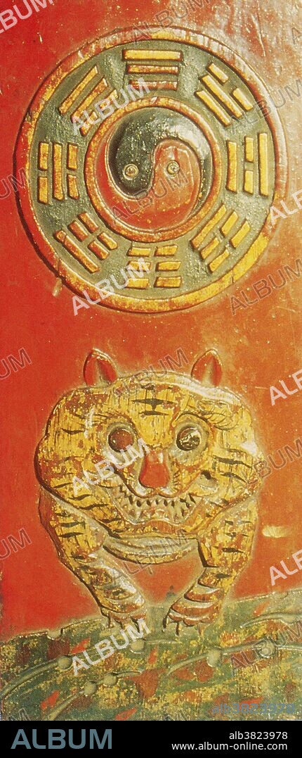 The Early Heaven Sequence of trigrams on a 19th century tailsman was used in Feng Shui to ward off evil influences. The Fu Xi Bagua, also know as the Earlier Heaven or Former Heaven Sequence is derived from the Ho Tu. The Former Heaven Sequence is the cosmic ideal while the Later Heaven Sequence is its earthly application. The tiger symbolizes the west. Its corresponding trigram is K'an. Feng Shui is a Chinese philosophical system of harmonizing everyone with the surrounding environment. It is closely linked to Daoism. Feng shui is one of the Five Arts of Chinese Metaphysics, classified as physiognomy (observation of appearances through formulas and calculations). The feng shui practice discusses architecture in metaphoric terms of "invisible forces" that bind the universe, earth, and humanity together, known as qi. A talisman is an object which is believed to contain certain magical properties which would provide good luck for the possessor or possibly offer protection from evil or harm.