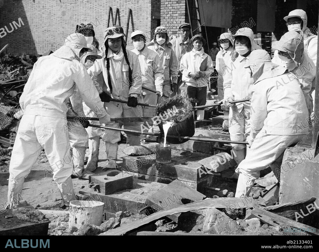 Women steel workers of the Chunghua Metallurgical Plant in Shanghai pouring molten steel that they smelted into sand moulds. Women have joined iron and steel making this year. Great Leap Forward. December 1958. (Photo by: Sovfoto/UIG via Getty Images).