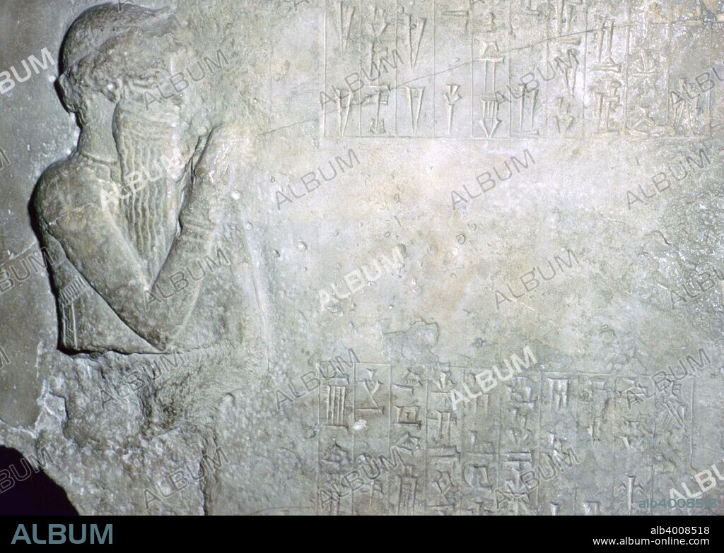 King Hammurapi at worship. Fragment of a stone stele dedicated by Itur-Ashdum, First Dynasty of Babylon, about 1760-1750 BC, probably from Sippar, southern Iraq. The figure carved to the left of the inscription may represent Hammurapi with his right arm raised in worship. According to the text Hammurapi would have been facing a figure of Ashratum across the inscription.