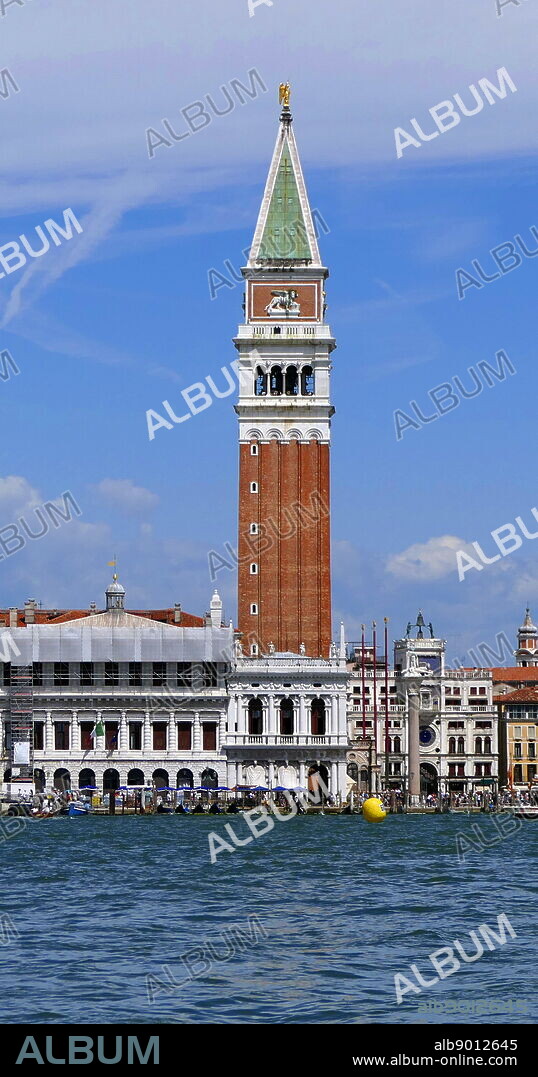 St Mark's Campanile, bell tower of St Mark's Basilica in Venice, Italy, located in the Piazza San Marco. The tower is 98.6 metres (323 ft) tall. The tower is capped by a pyramidal spire, at the top of which sits a golden weathervane in the form of the archangel Gabriel. The campanile reached its present form in 1514. The current tower was reconstructed in its present form in 1912.