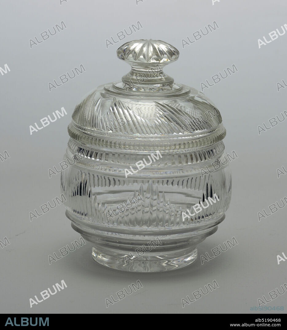 Jar and lid, Glass, Round body cut with vertical flutes in graduated lengths, prismatic cutting above and below, with vertical flutes around lip, a star on bottom of base; domed cover with mushroom finial cut with star, sides cut with blazes of graduated lengths and short row vertical flutes at outer rim., Ireland or England, ca. 1810, glasswares, Decorative Arts, Jar and lid.