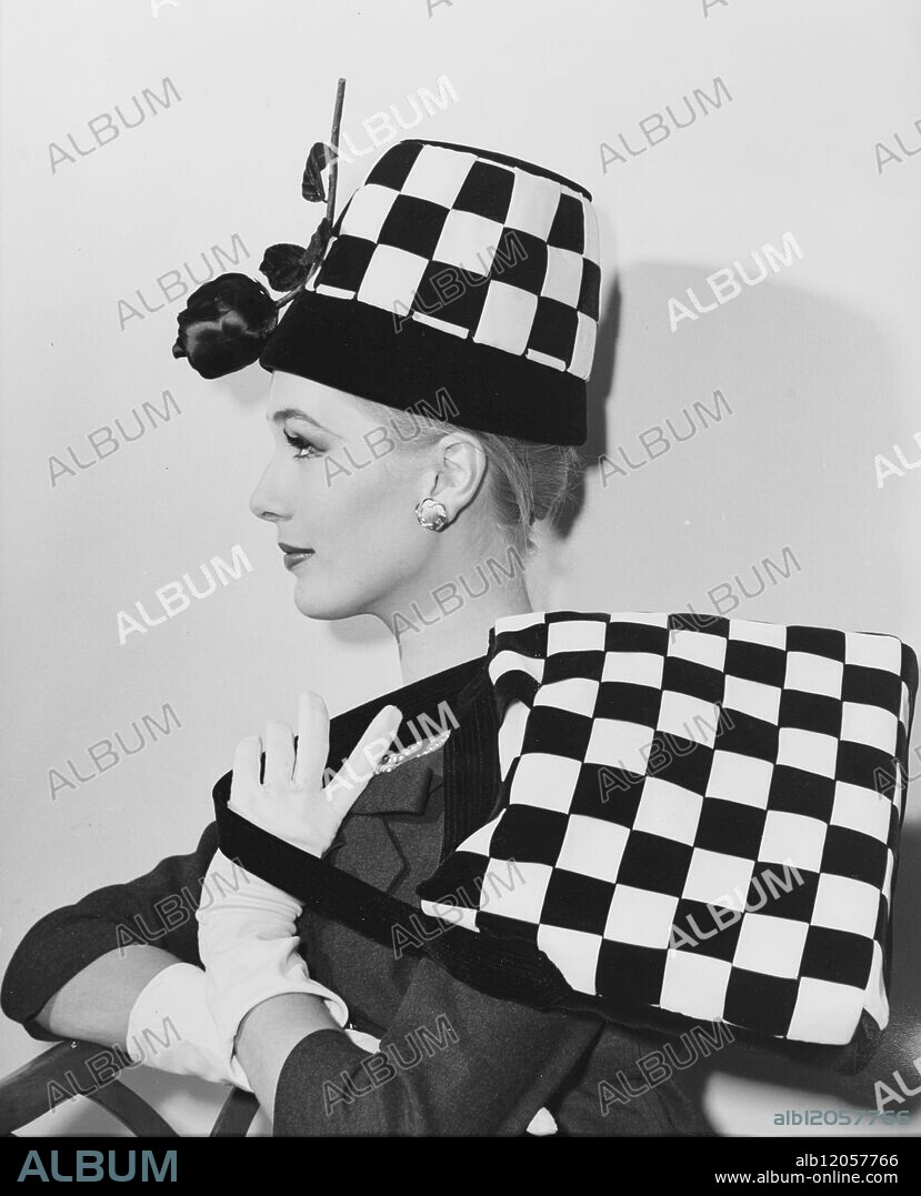 NEW HATS ON SHOW. The millinery Guild held its thirtieth COLLECTION OF MODEL MILLINERY AT THE DORCHESTER HOTEL TODAY , AND AMONG THE HATS MODELLED WAS " CHECK MATE " DESIGNED BY OLIVER NlBLETT . MODELLED BY JACQUELINE PERRIN, THE HAT IS IN THE " PLANT POT " STYLE OF LATTICED PATTERN IN BLACK And WHITE - VELVET RIBBON WITH A BLACK ROSE . A MATCHING handbag is carried by the model . 13 JUNE 1960.