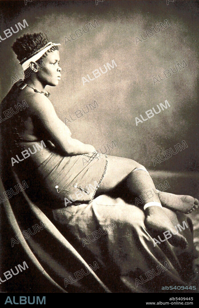 Zulu girl. In the Zulu family it is the duty of the wife to bring the children up and children are taught from an early age to respect elders and never speak unless spoken to. The wives are subservient to the husbands, bringing them their food before retiring to their own quarters. The husband will eat his fill and leave the rest for the remainder of his family. Girls are slowly introduced to the family chores by first learning how to carry water using a small gourd. She learns to carry the gourd on her head by means of braided supports that her mother applies to her head. In the field, she is taught how to plant and reap the crops and is given her own hoe when she is eleven. By this age, she is capable of making a fire, preparing some simple dishes and looking after her younger brethren. Image taken from page 373: A Holiday in South Africa by Ralph Watts Leyland, 1882.