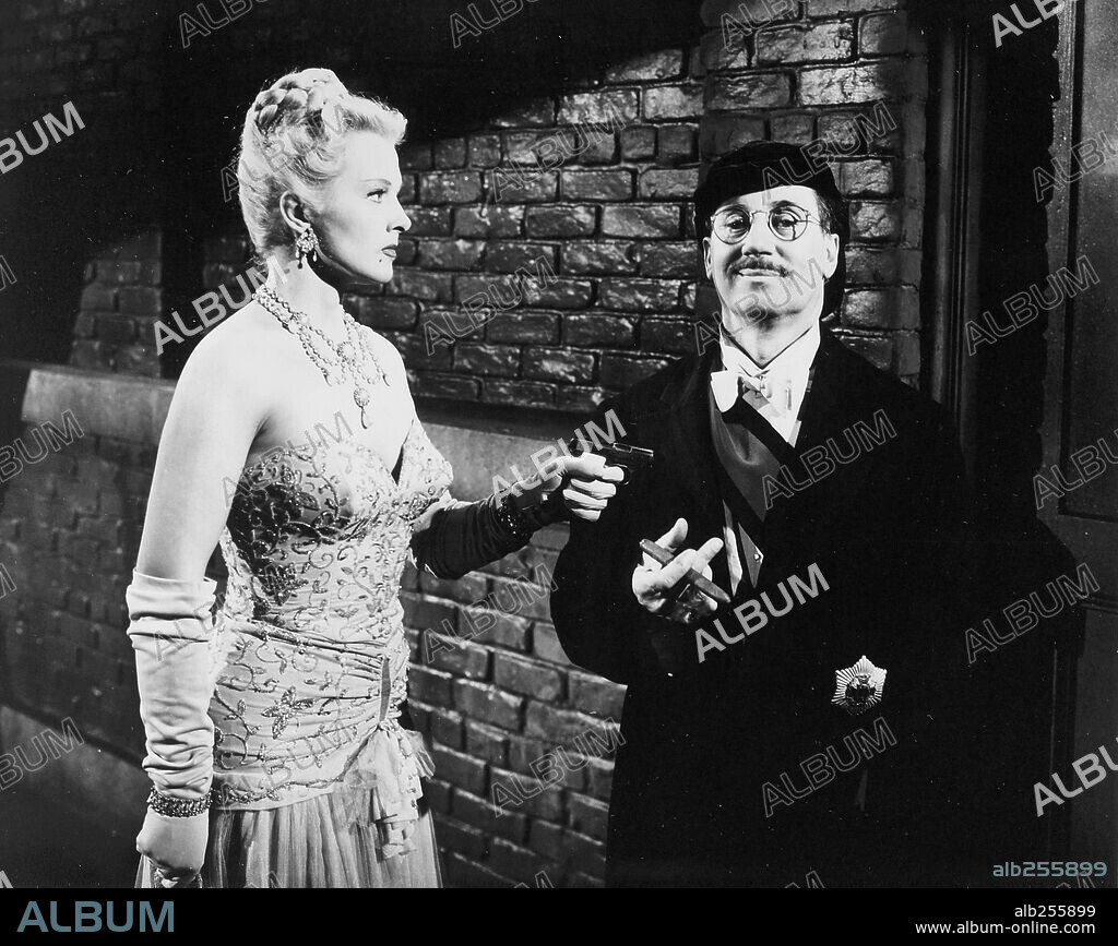GROUCHO MARX and ILONA MASSEY in LOVE HAPPY, 1949, directed by DAVID MILLER. Copyright UNITED ARTISTS.