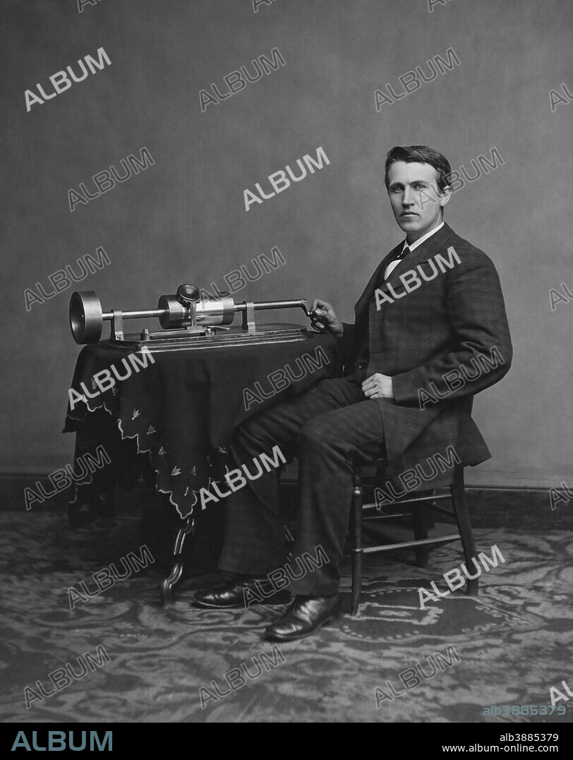 American inventor and businessman, Thomas Edison with his second phonograph, circa 1878.