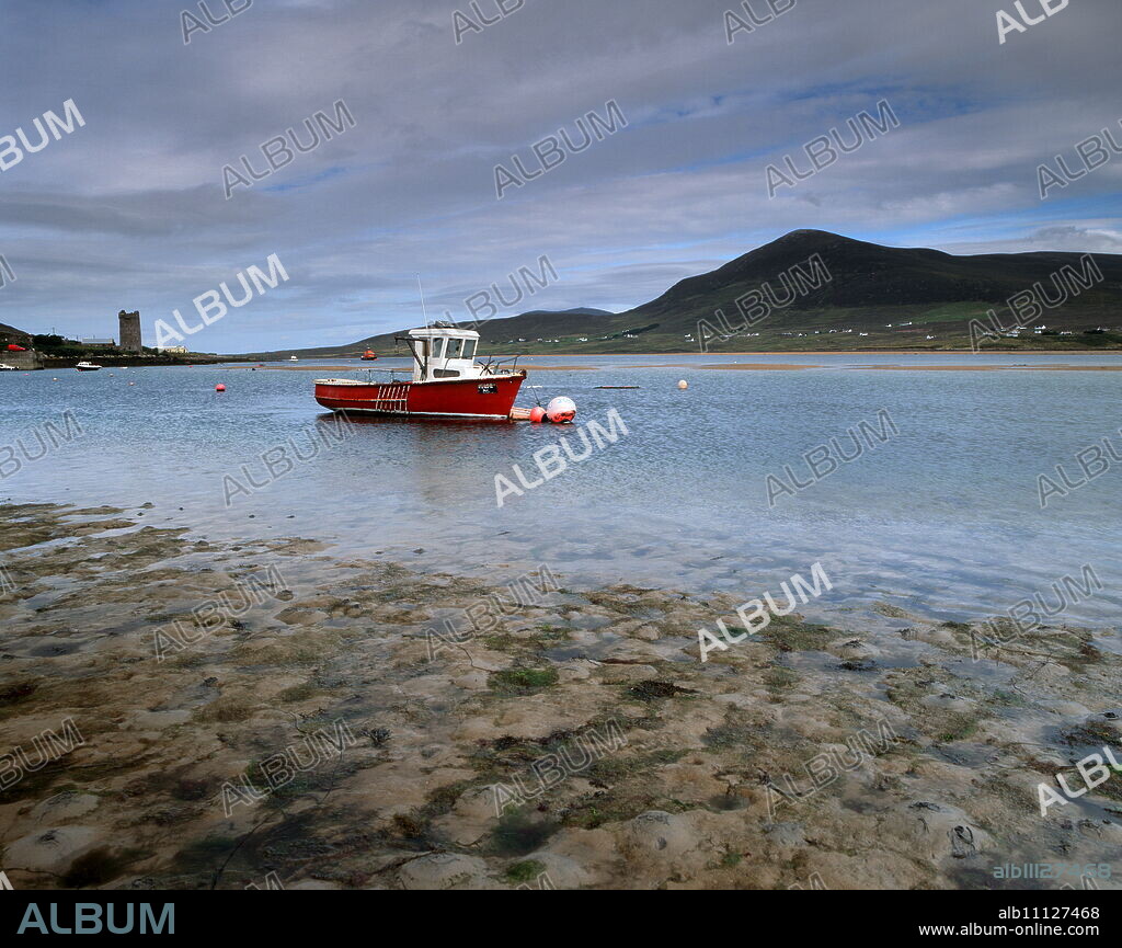 Red boat in Achill Sound at low tide, Achill Island, County Mayo, Connacht, Republic of Ireland, Europe.