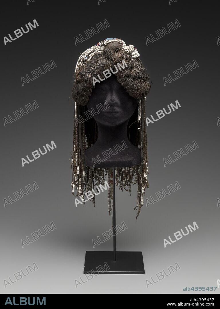woman's headdress, Mbukushu people, early to mid-20th century, cotton duck cloth, plant fiber (dyed raffia?), twill tape, glass beads, egg shell (?) beads, unidentified interior structure, 19-11/16 in., Textile and Fashion Arts.