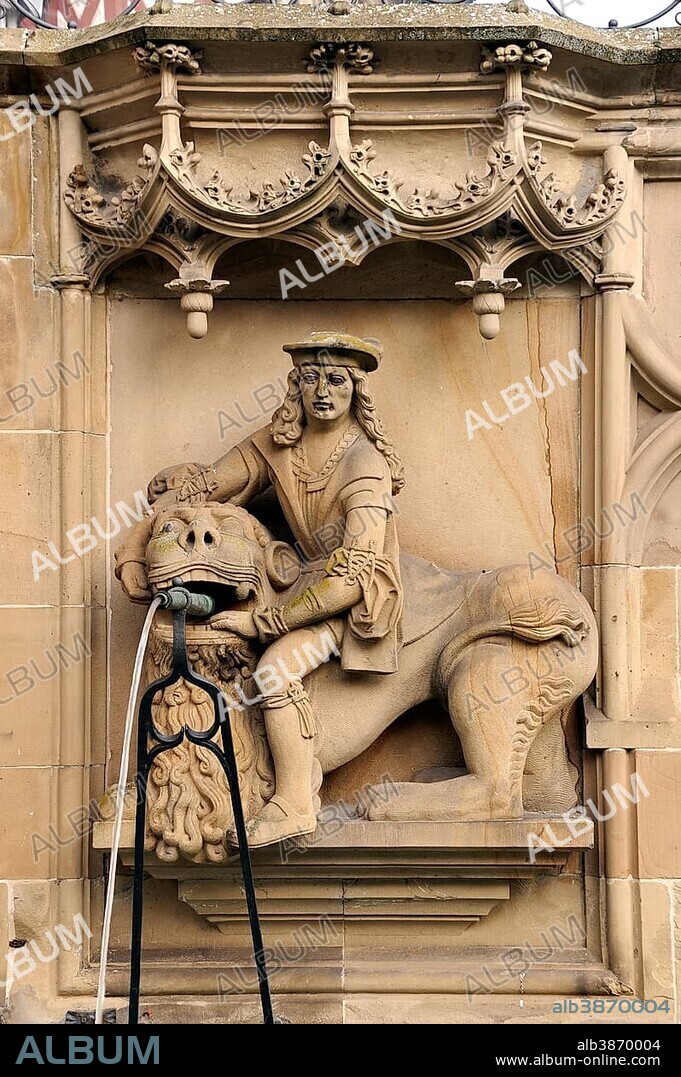 High relief of Samson with the Lion as a well figure on the Gothic Fischbrunnen fountain, built in 1509 by the Haller sculptor Hans Beuscher, Marktplatz square, Schwäbisch Hall, Baden-Wuerttemberg, Germany, Europe, PublicGround, Europe.