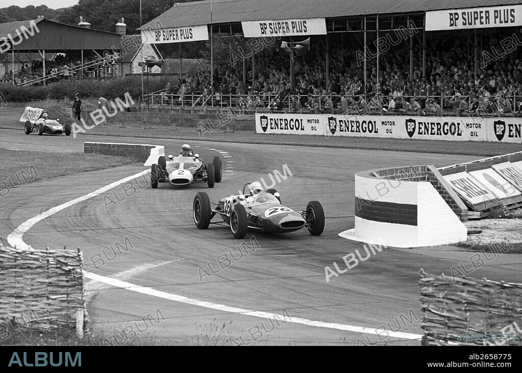 No 26 Alan Rees in a Lotus 20 won the race, No 2 Richard Prior in a Lola Mk 3 at the chicane in the II BARC Formula Junior Championship. Tourist Trophy, Goodwood, England 19 Aug 1961.