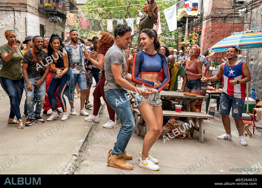 ANTHONY RAMOS and MELISSA BARRERA in IN THE HEIGHTS, 2021, directed by JON M. CHU. Copyright WARNER BROS PICTURES.