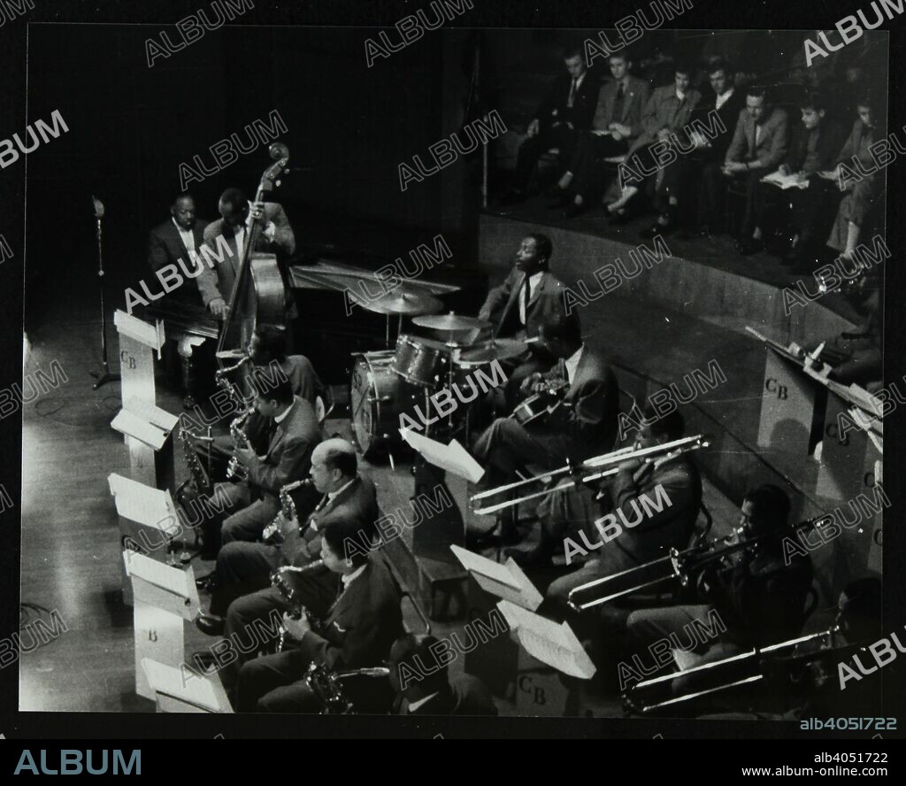 The Count Basie Orchestra in concert at Colston Hall, Bristol, 1957. Count Basie (piano), Eddie Jones (bass), Freddie Green (guitar) and Sonny Payne (drums). The saxophonists are (left to right) Eddie 'Lockjaw' Davis, Frank Wess, Marshall Royal, Frank Foster and Charlie Fowlkes. Trombones are (left to right) Henry Coker, Bill Hughes and Benny Powell.
