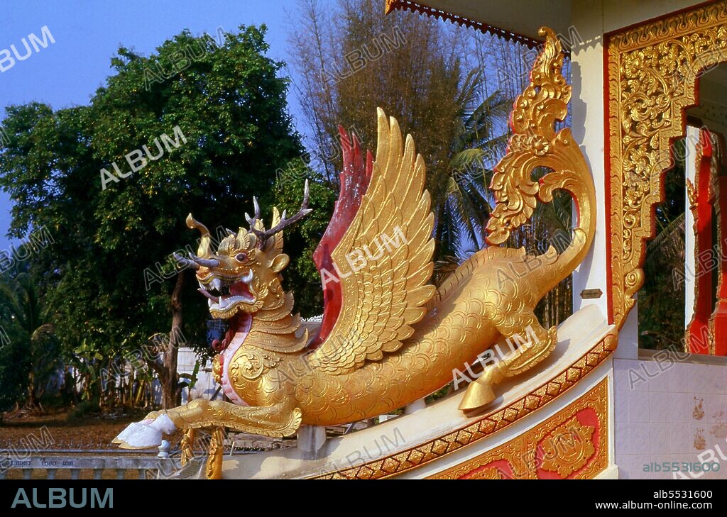 A Nawa Rupa is a mythical creature in Burmese folklore and is made from the amalgamation of parts of nine different animals. Mae Sariang is a small town and district (Amphoe) alongside the Yuam River in Mae Hong Son Province, northern Thailand, along the Myanmar border. The areas around Mae Sariang are mountainous and forested. The town has many links to Burma, such as its architecture and a large population of Burmese Muslims. Once one of Thailand’s remotest provinces, Mae Hong Son is now readily accessible by air from Chiang Mai, as well as by a wonderful loop drive through Mae Sariang and back via Pai and Soppong– or vice versa. Singularly isolated, Mae Hong Son is not yet very developed. The townsfolk may be citizens of Thailand, but most are Shan, Karen, Yunnanese Chinese or Hill Tribes. The temples are Burmese in style, and the pace of life amazingly tranquil.