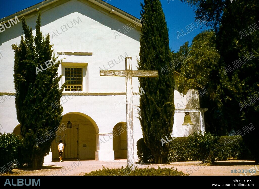 The exterior of Mission San Juan Bautista, a Spanish mission where daily mass has been held since its establishment in 1797, San Juan Bautista, California, 1955.