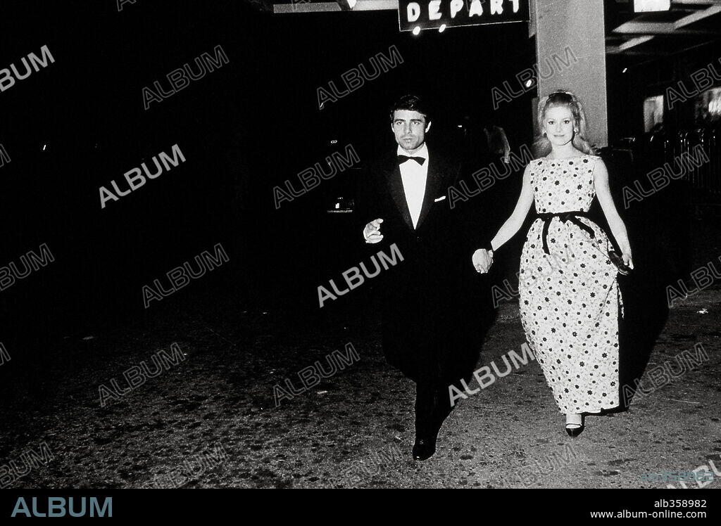 CATHERINE DENEUVE and NINO CASTELNUOVO in FILM HISTORY: CANNES. Nino Castelnuovo and Catherine Deneuve together during Cannes film festival. 1964