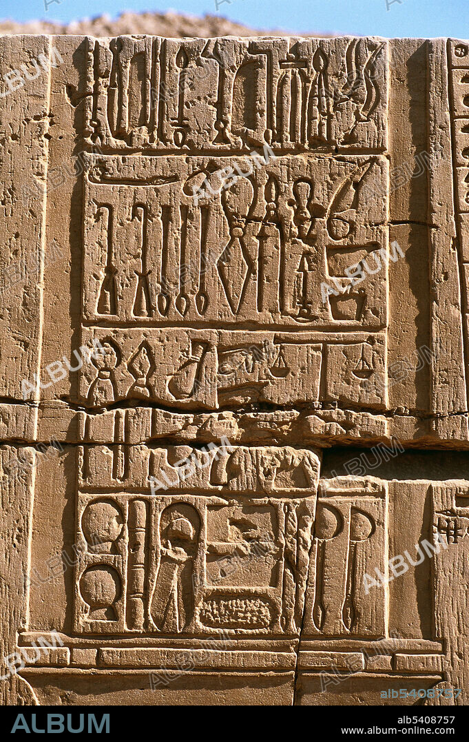 Ancient Egyptian wall relief showing a tall box of medical and surgical instruments carved into the wall. The relief includes a weighing scale (possibly for drug ingredients), cupping glasses, probes, sounds, spatulas, shears or scissors and galley pots or incense burners. Wall relief of the Greco Roman Period (332 BCE - CE 395) from the temple at Kom Ombo in Southern Upper Egypt, inner face of the outer corridor. This temple mostly dates from the Ptolemaic Period although New Kingdom remains have been found on this site. Supplied by Carole Reeves, courtesy of Wellcome Images.