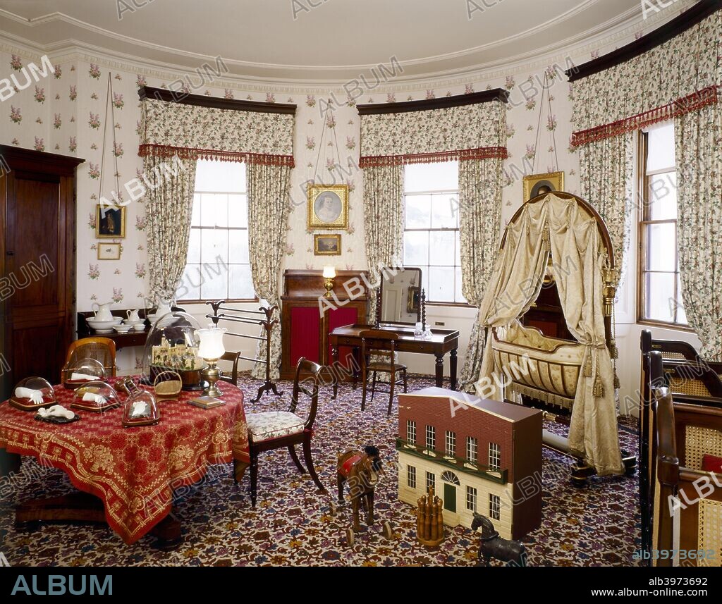 Osborne House, Isle of Wight, c1990-2010. Interior view of the Nursery Bedroom. Some items shown maybe on loan from the Royal Collection. A former royal residence in East Cowes, Isle of Wight, built between 1845 and 1851 for Queen Victoria and Prince Albert as a summer home and rural retreat. Designed in the style of an Italian Renaissance palazzo, built by Thomas Cubitt. Grade I listed and under the care of English Heritage.