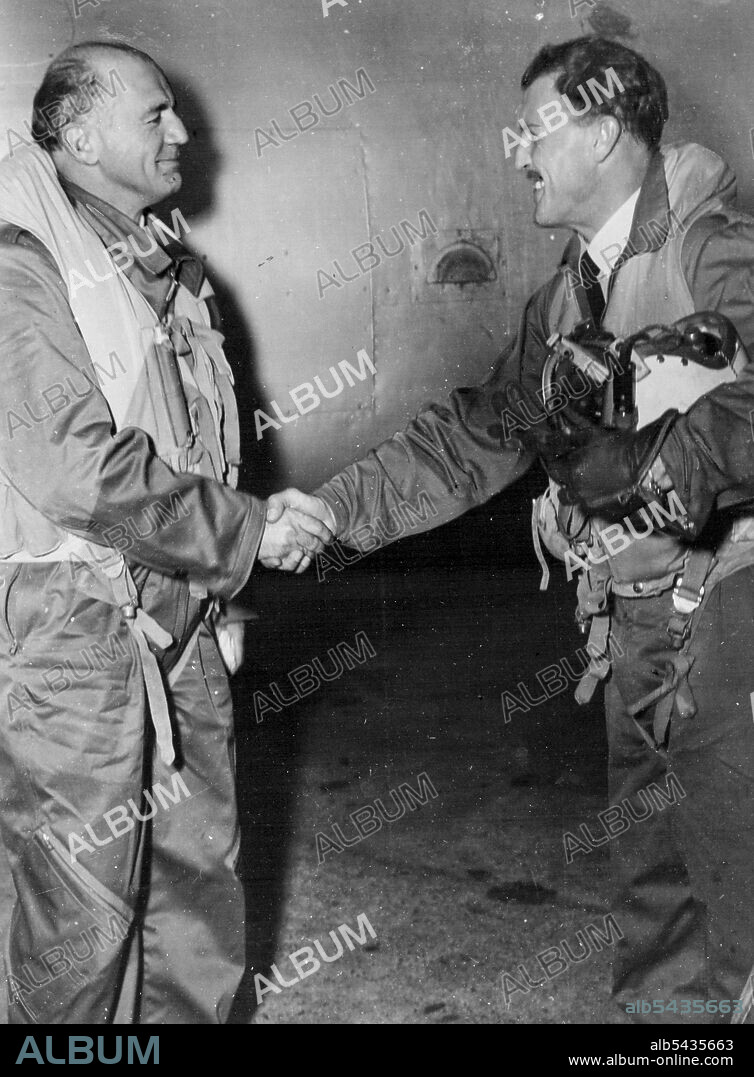 In Japan the Minister for Air, Mr. William McMahon, made his first jet flight in a two seat Meteor Mark 7 with flying officer Dick Wittman, of Sydney. It is shown congratulating the pilot after a "wonderful flight". December 01, 1952. (Photo by RAAF Official Photograph).