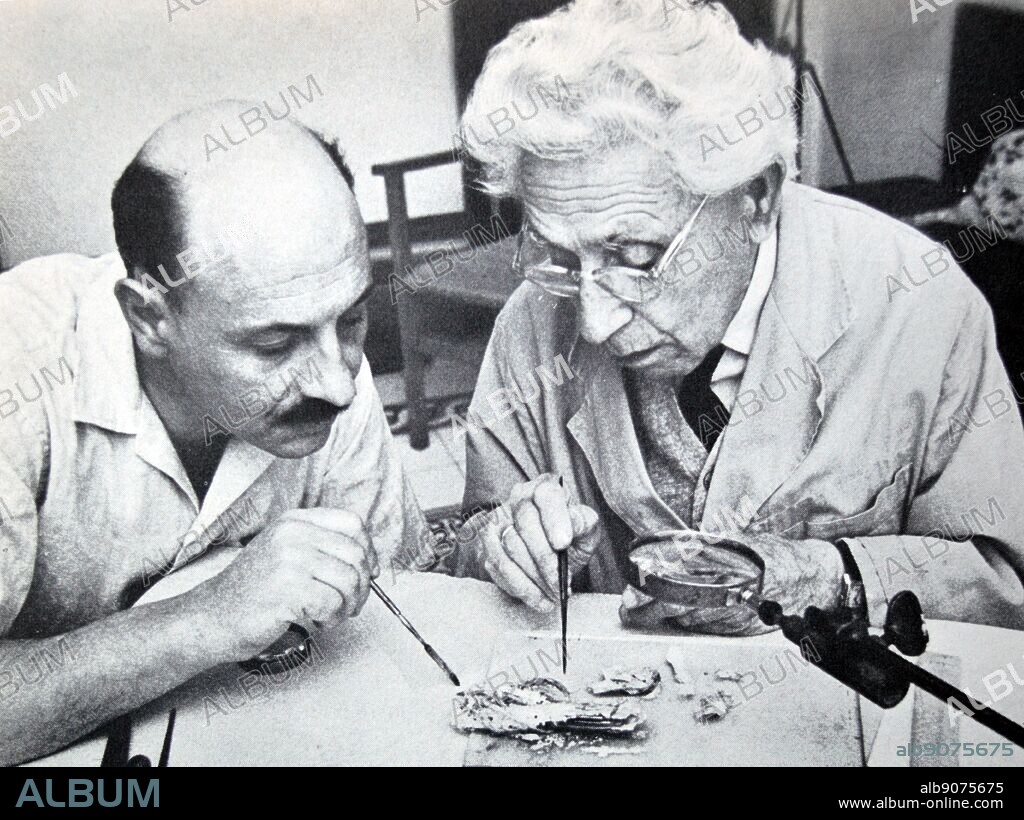 Israel's Professor yigal yadin and james biberkraut study samples from the dead sea scrolls 1965.