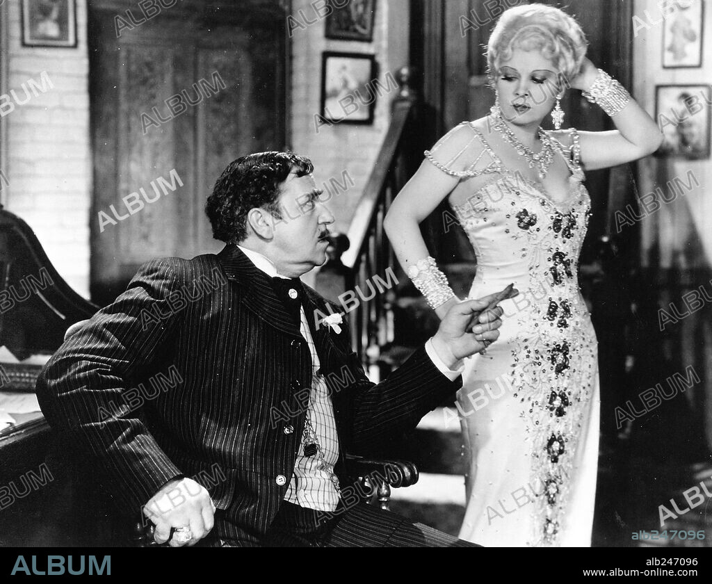 MAE WEST and NOAH BEERY SR. in SHE DONE HIM WRONG, 1933, directed by LOWELL SHERMAN. Copyright PARAMOUNT PICTURES.