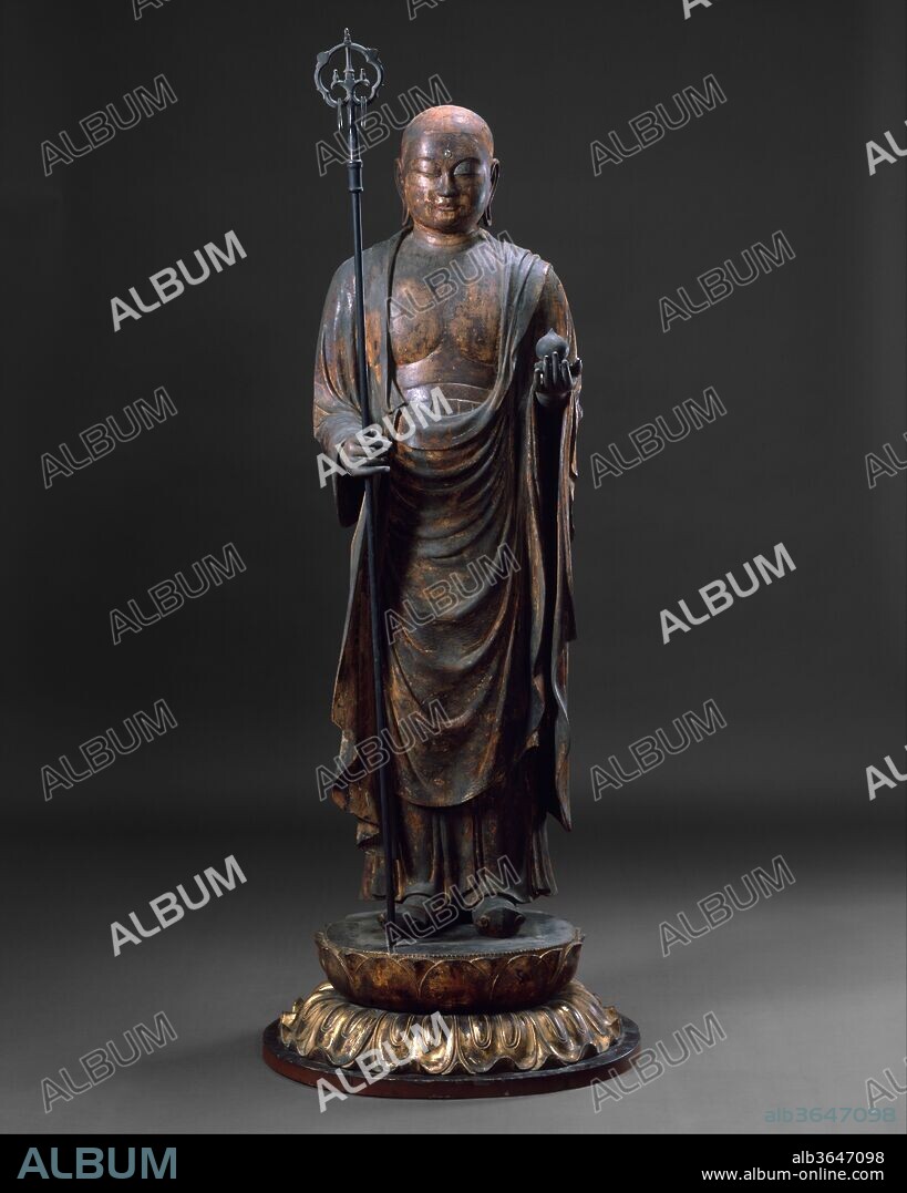Jizo Bosatsu. Culture: Japan. Dimensions: Figure with base: H. 71 1/2 in. (181.6 cm); W. 28 1/2 in. (72.4 cm); D. 22 1/2 in. (57.4 cm)
Figure with base and staff: H. 74 1/4 in. (188.6 cm). Date: late 12th-mid-13th century.
Jizo Bosatsu (bodhisattva) is usually represented as a gentle, boyish monk holding a wish-granting jewel (mani) in his left hand, and in his right a (shakujo), or monk's staff with six jangling rings to indicate his travels to succor creatures in need. Mendicant monks observed a rule of silence; they carried such a staff to announce their approach and to frighten away insects and animals lest they inadvertently tread on them. The six rings symbolize the Six Realms of Existence where Jizo is active and the Six Perfections that lead to nirvana: generosity, morality, patience, vigor, concentration, and wisdom. This shakujo finial bears an inscription that commemorates its dedication to a shrine or temple on the sacred mountain at Itsukushima. It has been displayed with this statue since early in the twentieth century.