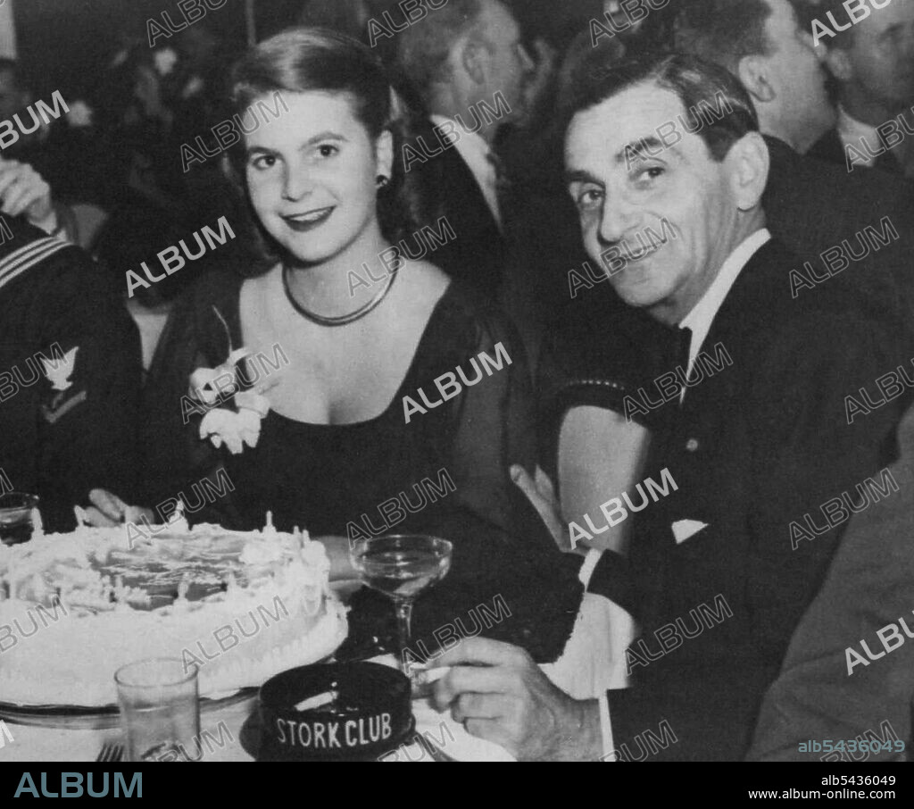 Berlin and Daughter Celebrate. Irving Berlin, Noted Song Writer, and his daughter, Mary Ellis, Share Birthday Cake at the Stork Club in New York, Nov 27, as they celebrate Mary Elli's 19th Birthday Anniversary. November 28, 1945. (Photo by Associated Press Photo).