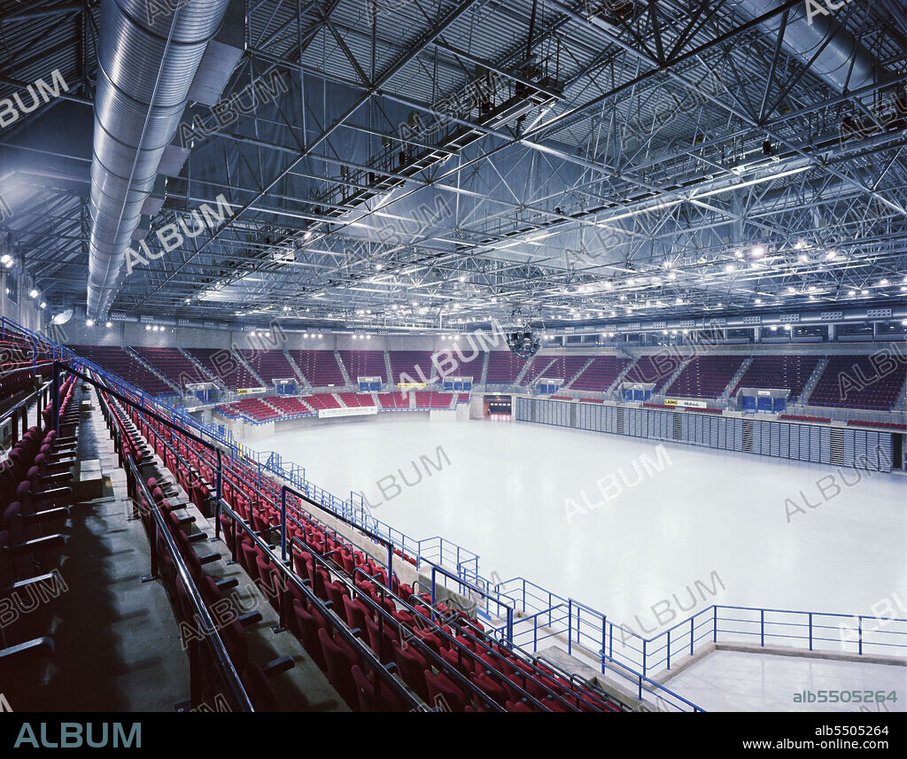 JOHN LAING PLC. National Indoor Arena, King Edwards Road, Birmingham, 26/07/1991. An interior view of the completed National Indoor Arena in Birmingham, taken from the tiered spectator seating. The £50m Design and Construct contract for the National Indoor Arena (NIA) was awarded to the Laing Midlands Division by Birmingham City Council in January 1989. It was officially opened on 4th October 1991 by athlete Linford Christie. At the time of opening, it was the largest indoor arena in the UK and had capacity for approximately 12,000 spectators. The arena has been renamed multiple times throughout its history. Originally the National Indoor Arena (October 1991 to December 2014), it later became known as The Barclaycard Arena (December 2014 to August 2017), Arena Birmingham (September 2017 to April 2020), and Utilita Arena Birmingham (April 2020 to present).