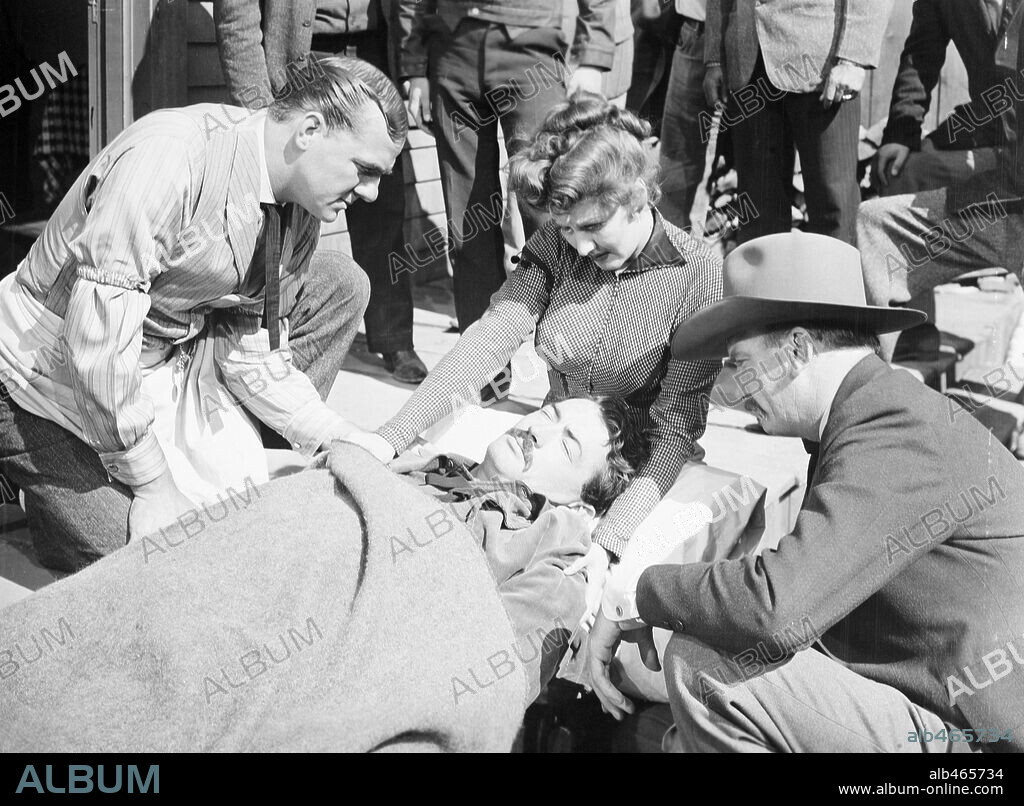 GREGORY PECK, JEAN PARKER, KARL MALDEN and MILLARD MITCHELL in THE GUNFIGHTER, 1950, directed by HENRY KING. Copyright 20TH CENTURY FOX.