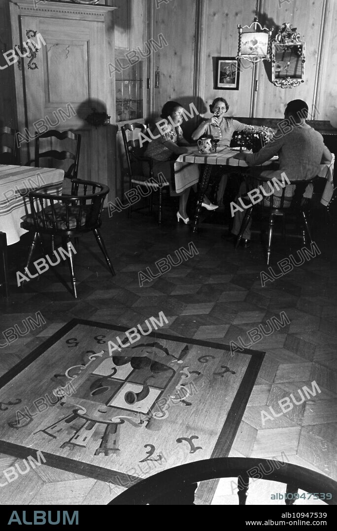 Relaxation in Hotel Wehrle in Triberg during a journey to the Black Forest, Germany 1930s.