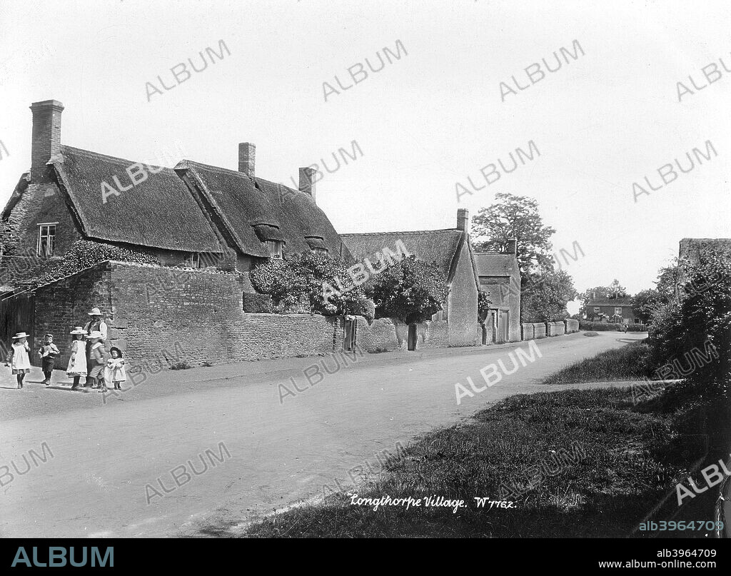 Longthorpe, Peterborough, Cambridgeshire, 1890-1910. A village street with a group of children on the left.