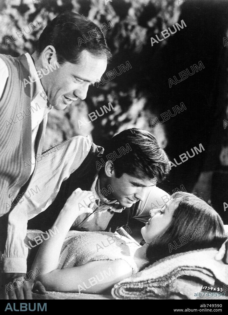 ANTHONY PERKINS, AUDREY HEPBURN and MEL FERRER in GREEN MANSIONS, 1959, directed by MEL FERRER. Copyright M.G.M.