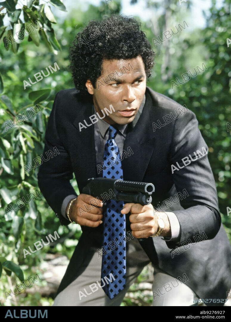 PHILIP MICHAEL THOMAS in MIAMI VICE, 1984, directed by JOHN NICOLELLA, LEON ICHASO and RICHARD COMPTON. Copyright UNIVERSAL TV.