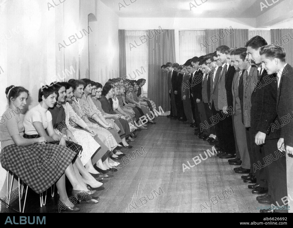 Asking for a dance: The men learn how to ask the women for a dance in a dancing school in Kaiserslautern, photographed on the 20th of November in 1958. 20/11/1958