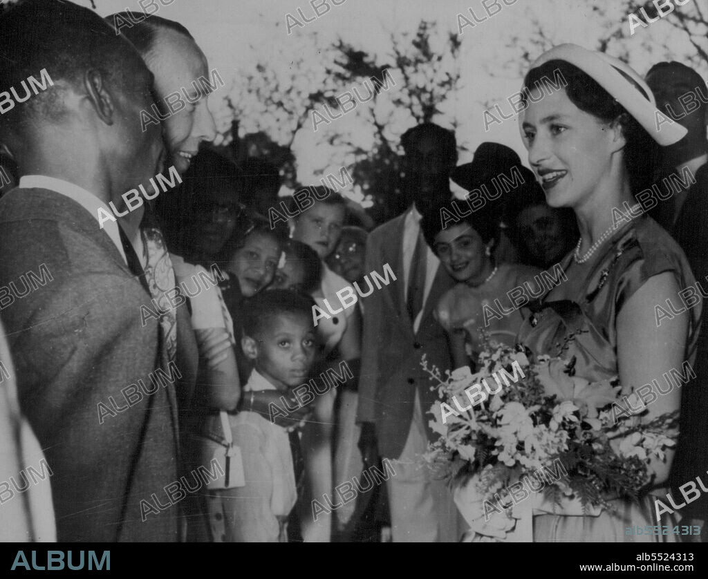 Princess Margaret in Barbados -- Princess Margaret talking with one of the booth owners when she visited the Barbados Industries and Trade Fair during her stay on the Island.Princess Margaret continuing her Caribbean tour, has now arrived in Antigua, the sixth island she has visited in her tour so far. February 15, 1955. (Photo by Paul Popper, Paul Popper Ltd.).
