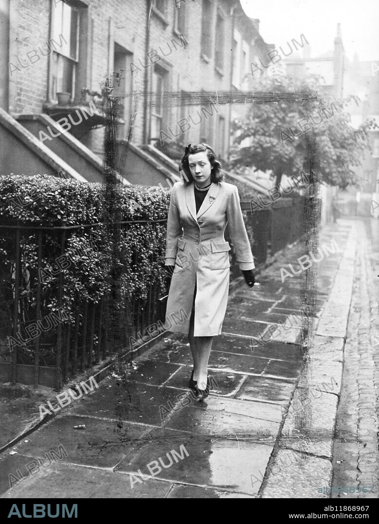 Mrs Veronica Hugo, 24, an artist's model of Edith Grove, Chelsea, was remanded on bail when she appeared before the West London magistrates Court. She is charged with demanding £200 with menaces from a Chertsey businessman who was referred to as Mr X and the court proceedings. 21 May 1947.