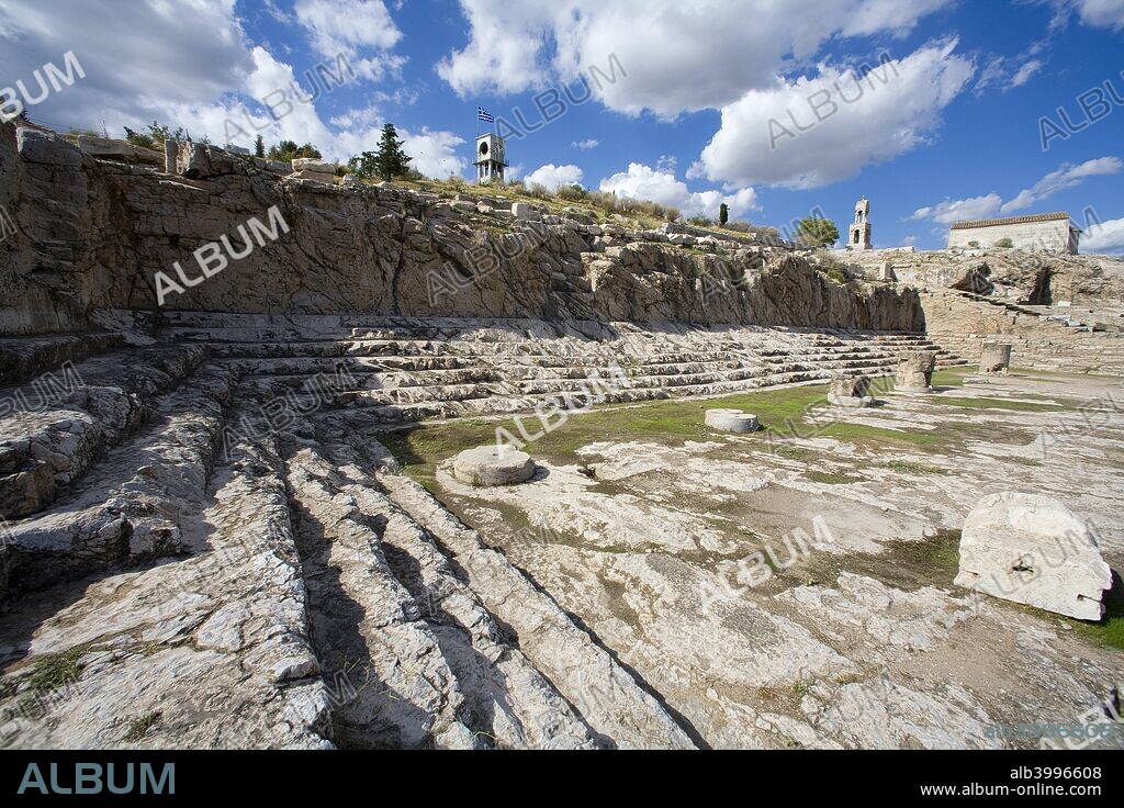 The Telesterion at Eleusis, Greece. The central feature of the sanctuary at Eleusis is the Telesterion. The Solonic Telesterion was erected about 600 BC on the site of a small Mycenaean temple of the 14th century BC, with an Anaktoron (holy of holies) which remained until Roman times the central element in the structure. Remains of these earlier buildings were found near the east corner of the Telesterion. Ancient Eleusis lies within the present-day industrial town of Elevsis (Elefsina) in Greece.