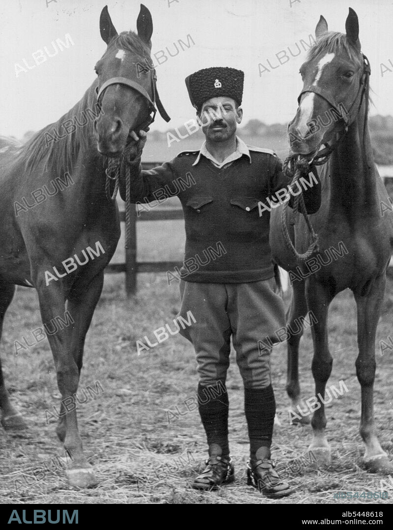 The Princesses Arab Horses at Melton Mowbray - The two magnificent Arab horses given to Princess Elizabeth and Princess Margaret Rose by the Emir Abdulla of Transjordan, are at the R.A.V.C. Remount depot, Melton ***** (Leicestershire) for examination before being presented to the Princesses. With them is Farrier Q.M.S. Mahud Fakaria, of the Transjordan Frontier Force, who brought the horses to England. He is to take part in June 8th's London Victory Parade Mowbray R.A.V.C. remount depot. May 26, 1946. (Photo by Reuterphoto).