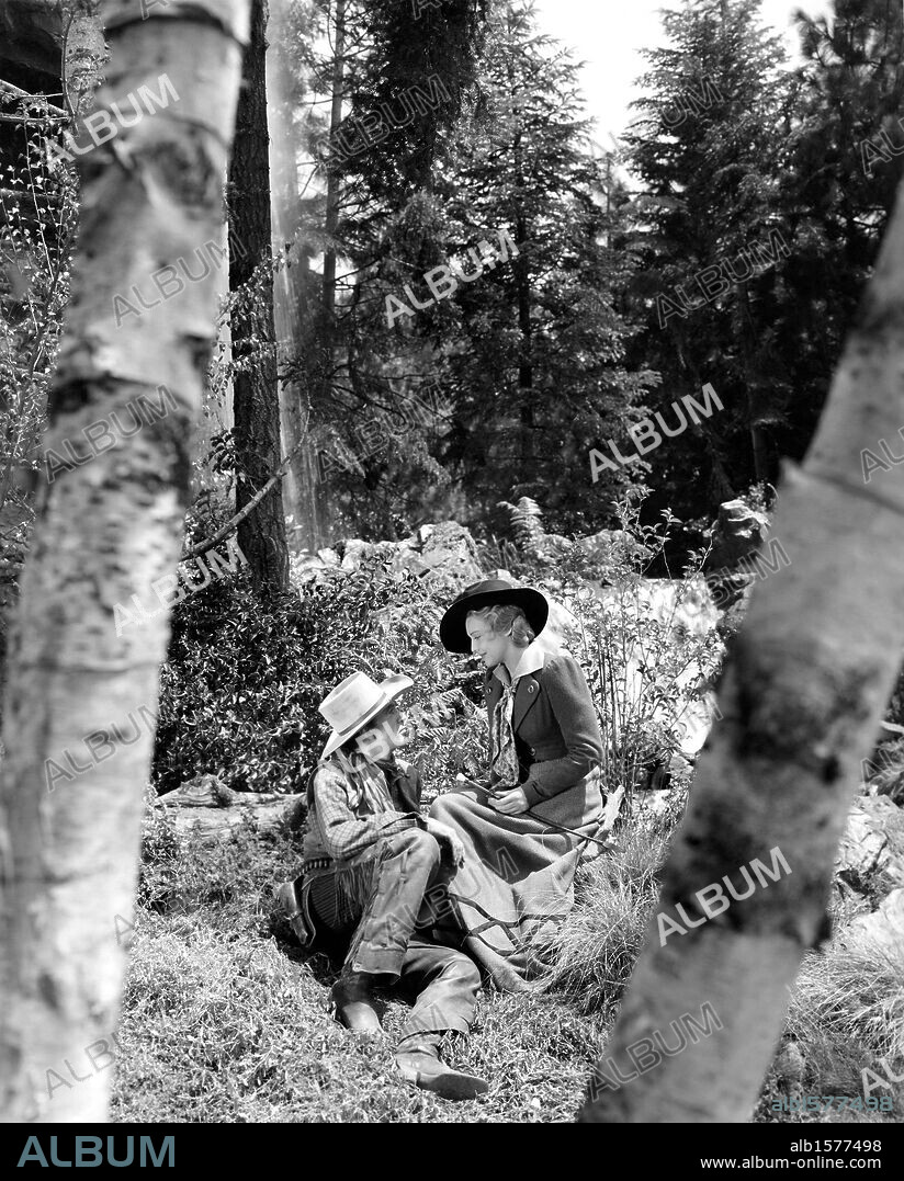 GARY COOPER and MADELEINE CARROLL in NORTH WEST MOUNTED POLICE, 1940, directed by CECIL B DEMILLE. Copyright PARAMOUNT PICTURES.