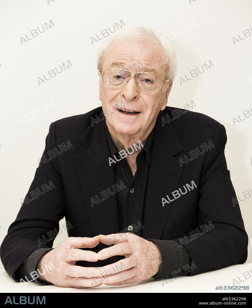 MICHAEL CAINE.  November 16, 2015 - Hollywood, California, U.S. - MICHAEL CAINE promotes 'Youth'. Sir Michael Caine, CBE (born Maurice Joseph Micklewhite; March 14 1933) is an English actor and author. Renowned for his distinctive working class cockney accent, Caine has appeared in over 115 films and is regarded as a British film icon. He made his breakthrough in the 1960s with Zulu (1964), The Ipcress File (1965), Alfie (1966), for which he was nominated for an Academy Award, The Italian Job (1969), and Battle of Britain (1969). His most notable roles in the 1970s included Get Carter (1971), The Last Valley, Sleuth (1972), for which he earned his second Academy Award nomination, The Man Who Would Be King (1975), and A Bridge Too Far (1977). He achieved some of his greatest critical success in the 1980s, with Educating Rita (1983) earning him the BAFTA and Golden Globe Award for Best Actor. In 1986, he received an Academy Award for Best Supporting Actor for his performance in Woody Allen's Hannah and Her Sisters. Caine played Ebenezer Scrooge in The Muppet Christmas Carol (1992). Having by that time practically retired from acting on the big screen, he enjoyed a career resurgence in the late 1990s, receiving his second Golden Globe Award for his performance in Little Voice in 1998 and receiving his second Academy Award for Best Supporting Actor for The Cider House Rules the following year. Caine played Nigel Powers in the 2002 parody Austin Powers in Goldmember, and Alfred Pennyworth in The Dark Knight Trilogy. He appeared in several other of Nolan's films including The Prestige (2006), Inception (2010), and Interstellar (2014). He also appeared as a supporting character in Children of Men and Pixar's 2011 film Cars 2. As of February 2017, films in which he has starred have grossed over 3.5 billion domestically and over 7.8 billion worldwide. Caine is ranked the eleventh highest grossing box office star. Caine is one of only two actors nominated for an Academy Award for acting in e. 16/11/2015