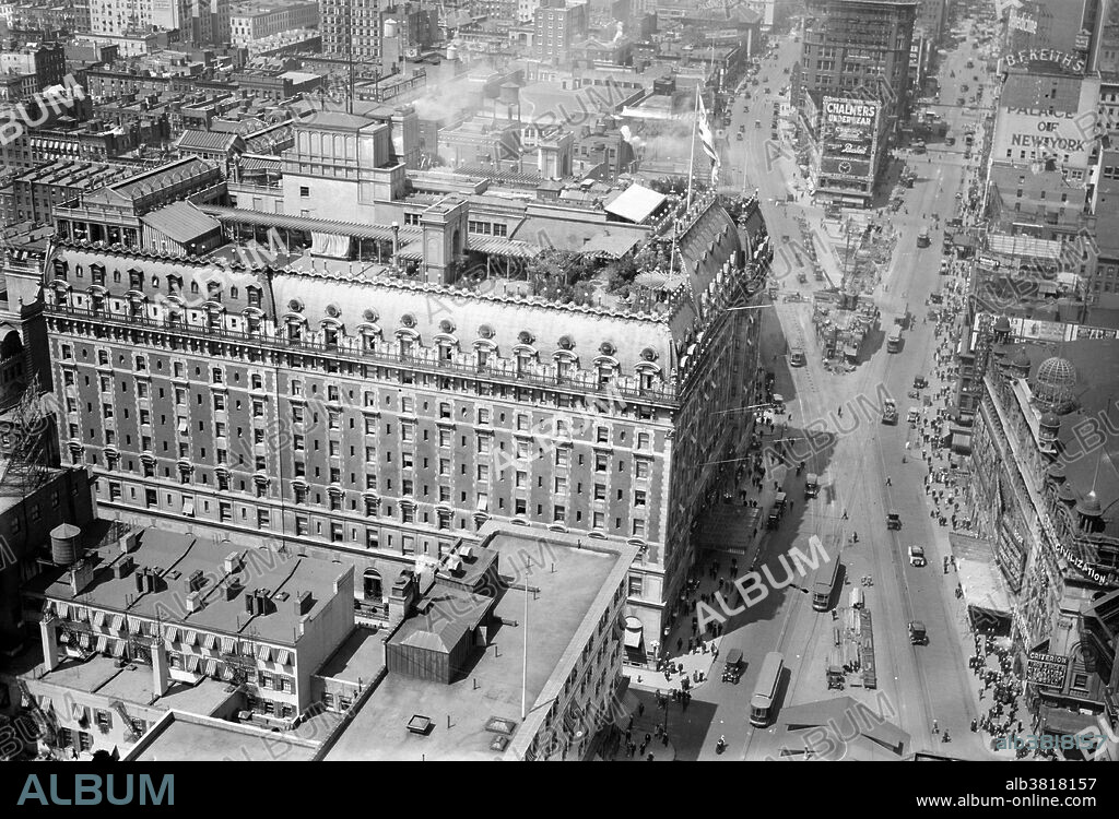 Hotel Astor was located in the Times Square area of Manhattan, in operation from 1904-67. The 35,000 square feet Hotel Astor was built in two stages, in 1905 and 1909-10, by the architects Clinton and Russell. Upon completion, the structure occupied an entire city block at a reported total cost of $7 million. Within its restrained exterior, the Astor featured a long list of elaborately themed ballrooms and exotic restaurants. The rooftop garden, with bandstand and observatory, was one of a number constructed in the city between 1880 and Prohibition. The Astor was an important element in the growth of Times Square and its character as an entertainment center. The Astor set the pattern for "a new species of popular hotels that soon clustered around Times Square, vast amusement palaces that catered to crowds with scenographic interiors that mirrored the theatricality of the Great White Way." It closed and was demolished in 1967. Photographed by Bain News Service, 1915-20.