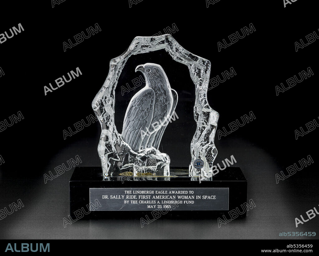 MALCOLM & HAYES. Lindbergh Eagle Award presented to Sally Ride, 1985. This Lindbergh Eagle award was given to Dr. Sally K. Ride in May 1985 to honor her achievement as the first American woman in space. Anne Morrow Lindbergh, widow of the famed aviator Charles A. Lindbergh, presented the award at a ceremony during Minneapolis' Lindbergh Heritage week. Lindbergh, who had often flown with her husband as a co-pilot, navigator, and radio operator, modestly declined the comparison made between herself and Ride as flight "pioneers," saying that Ride was more deserving of the title.