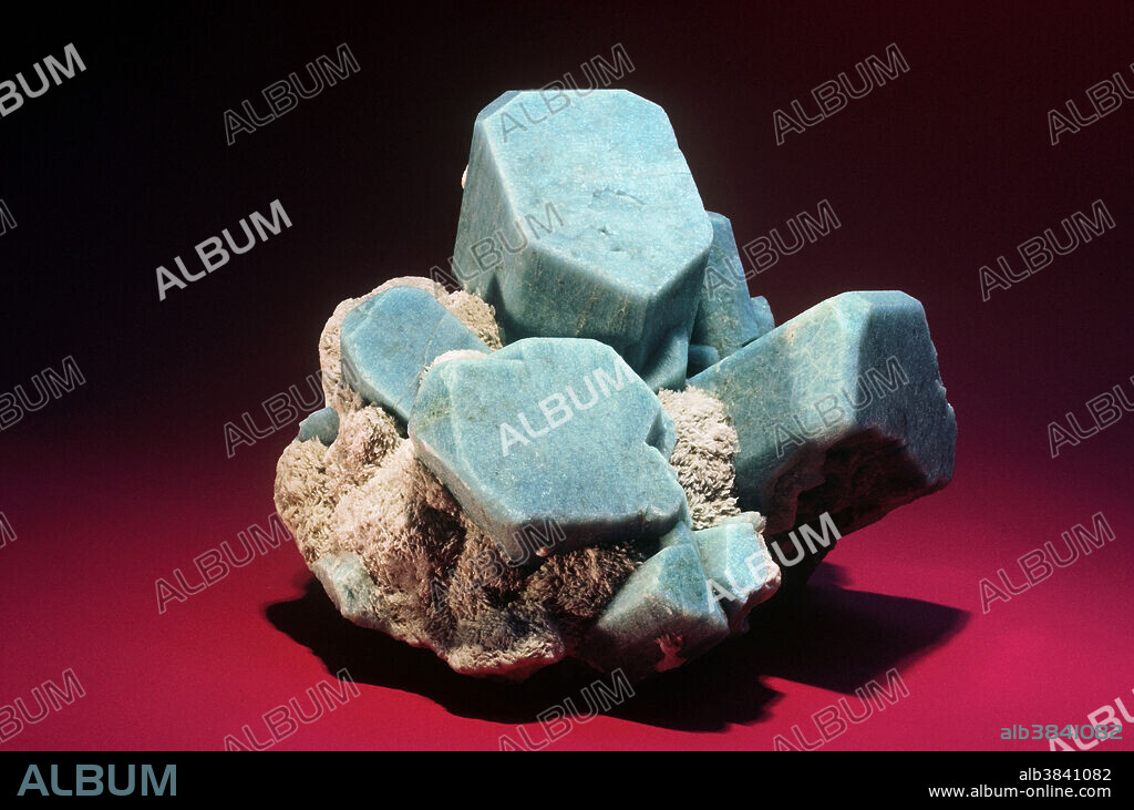 Amazonite is a green or bluish-green variety of the feldspar group mineral known as microcline. Microcline forms some of the largest mineral crystals ever found. The amazonite from Florissant, Colorado is popular among collectors because it forms excellent, well shaped crystals, typically occurring with smoky quartz crystals.