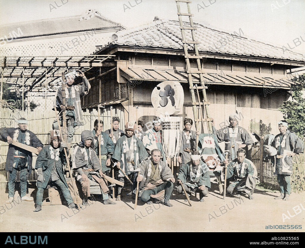 [ 1880s Japan - Japanese Firemen ] Firefighter brigade with their Matoi fire standard. In 1720, the Hikeshigumi of Edo (pre-1868 Tokyo) were organized into 48 units, each with their own unique Matoi. The firefighters in this image are holding Tobiguchi, special firefighting pikes. Instead of extinguishing fires, Hikeshigumi tore down neighboring buildings to prevent the fire from spreading. 19th century vintage albumen photograph.