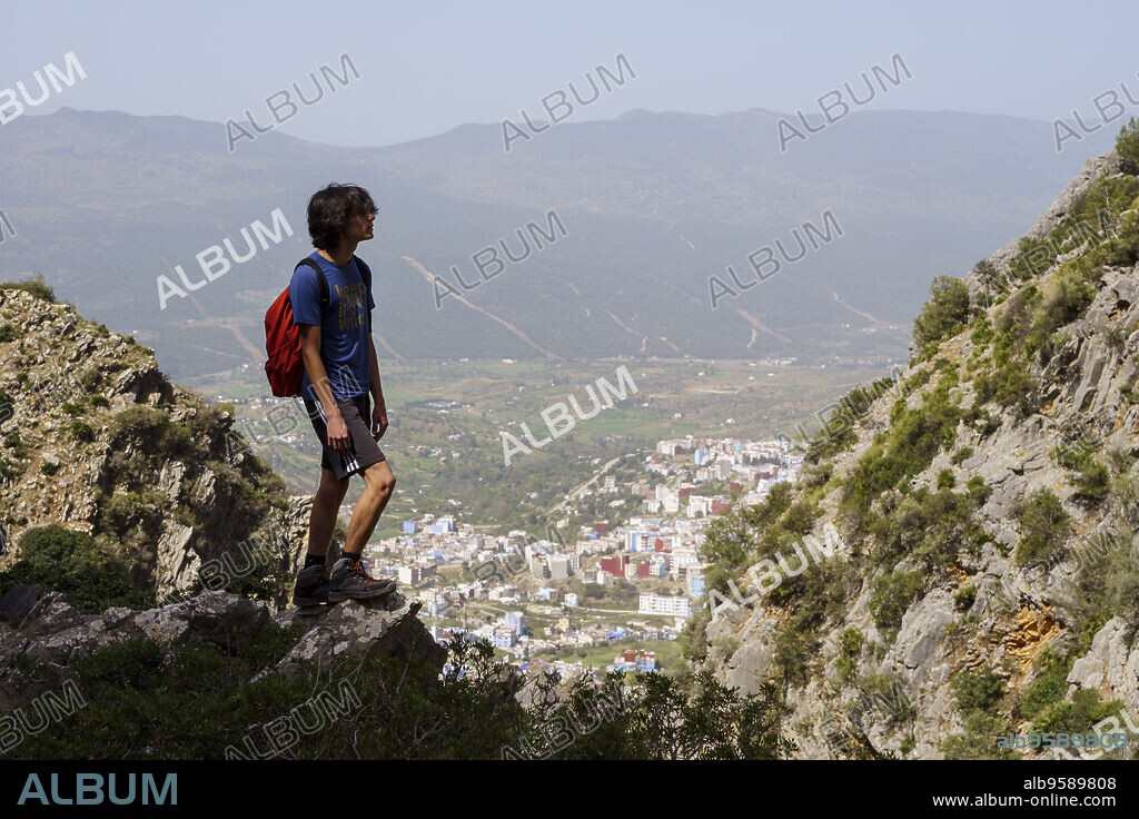 hikers ascending towards Jebel Tizouka, Chefchaouen, Talassemtane National Park, morocco, africa.
