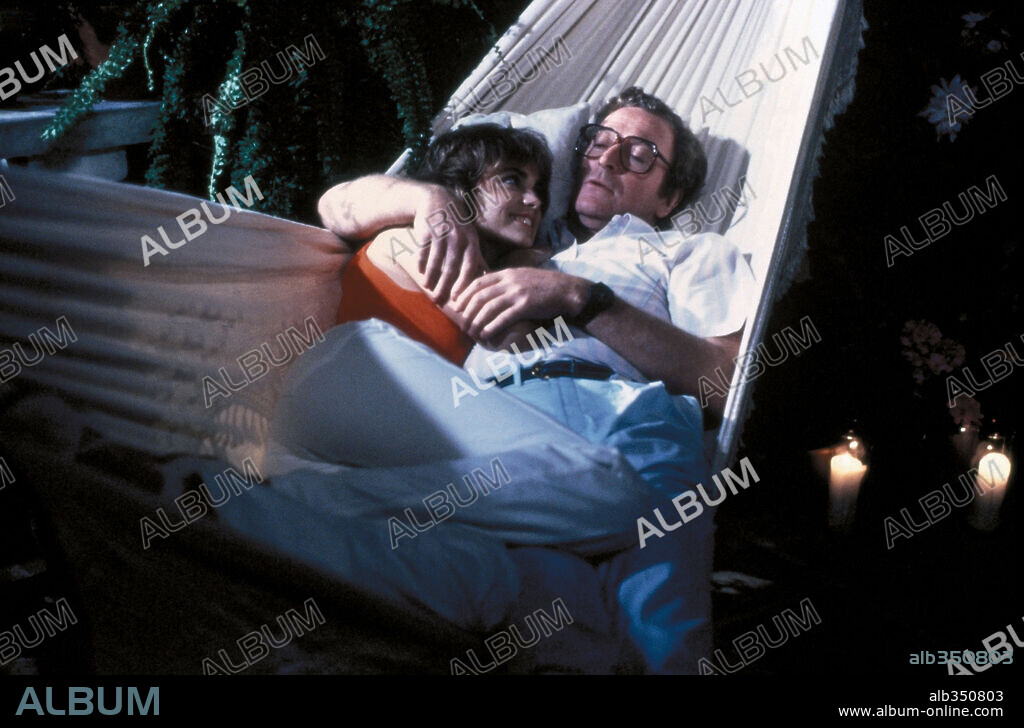 MICHAEL CAINE and MICHELLE JOHNSON in BLAME IT ON RIO, 1984, directed by STANLEY DONEN. Copyright 20TH CENTURY FOX.