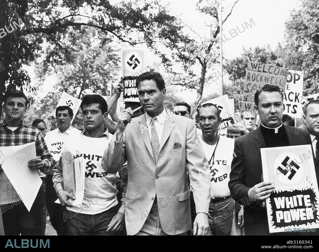 United States: 1967 American Nazi Party founder George Lincoln Rockwell leading a group of his supporters.
