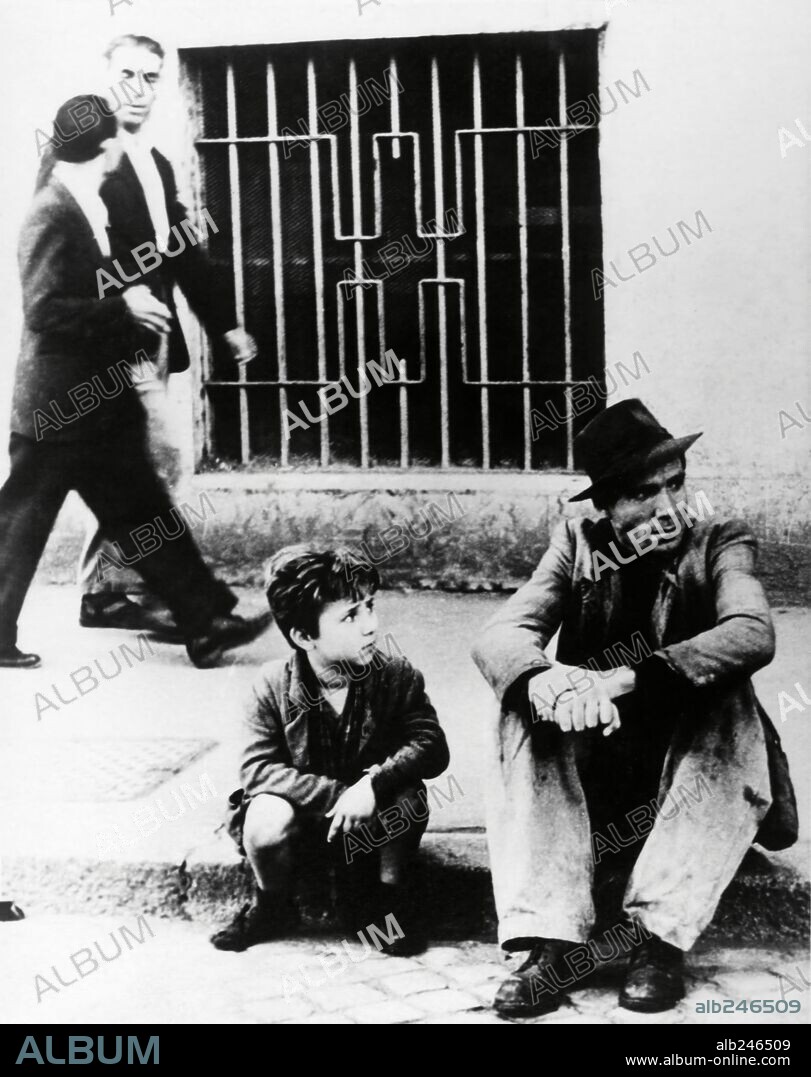 ENZO STAIOLA and LAMBERTO MAGGIORANI in BICYCLE THIEF, 1948 (LADRI DI BICICLETTE), directed by VITTORIO DE SICA. Copyright PDS/ENIC.