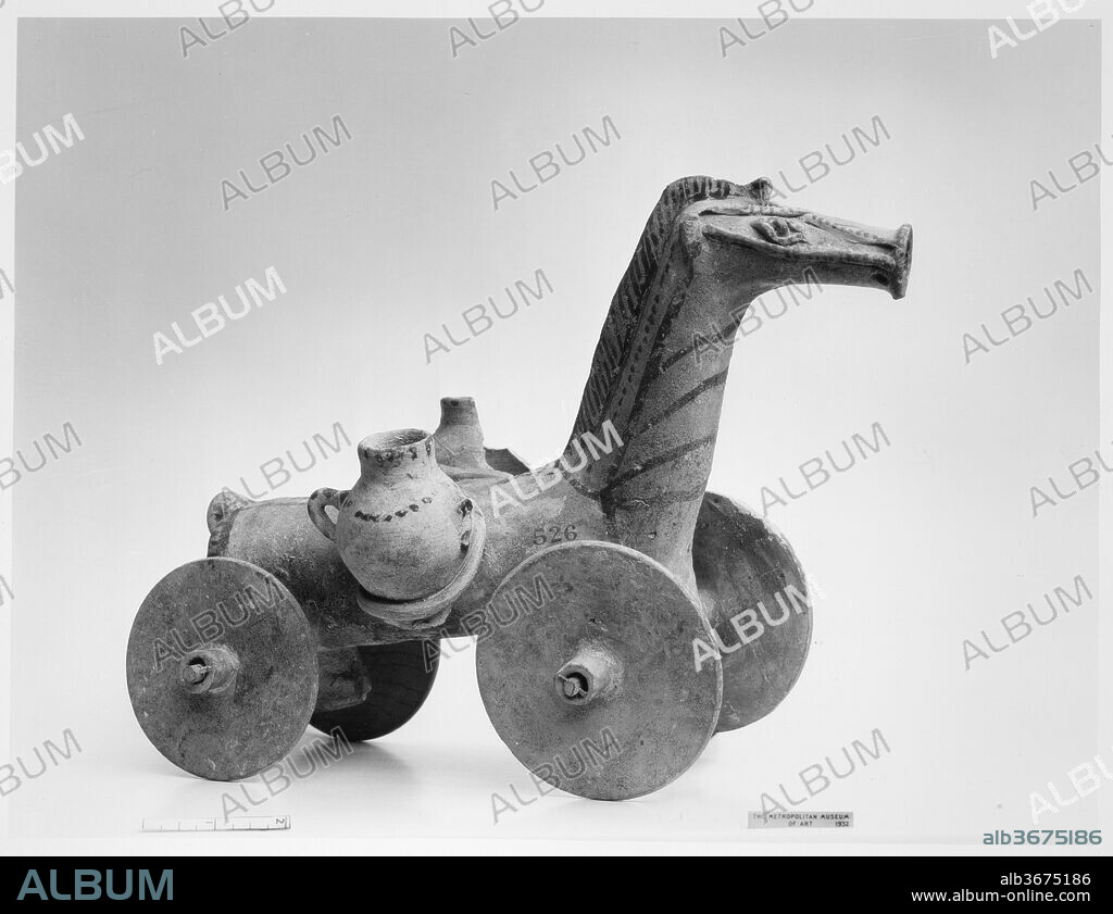 Terracotta wheeled horse. Culture: Cypriot. Dimensions: H. 8 7/8 in. (22.6 cm). Date: 6th century B.C.(?).
With characteristic imagination, not to say extraordinary foresight, the Cypriot modeler has equipped a draft horse with wheels. On its back it carries two storage jars. From other Greek examples, scholars have hypothesized that these wheeled horses were toys and that the containers carried water.