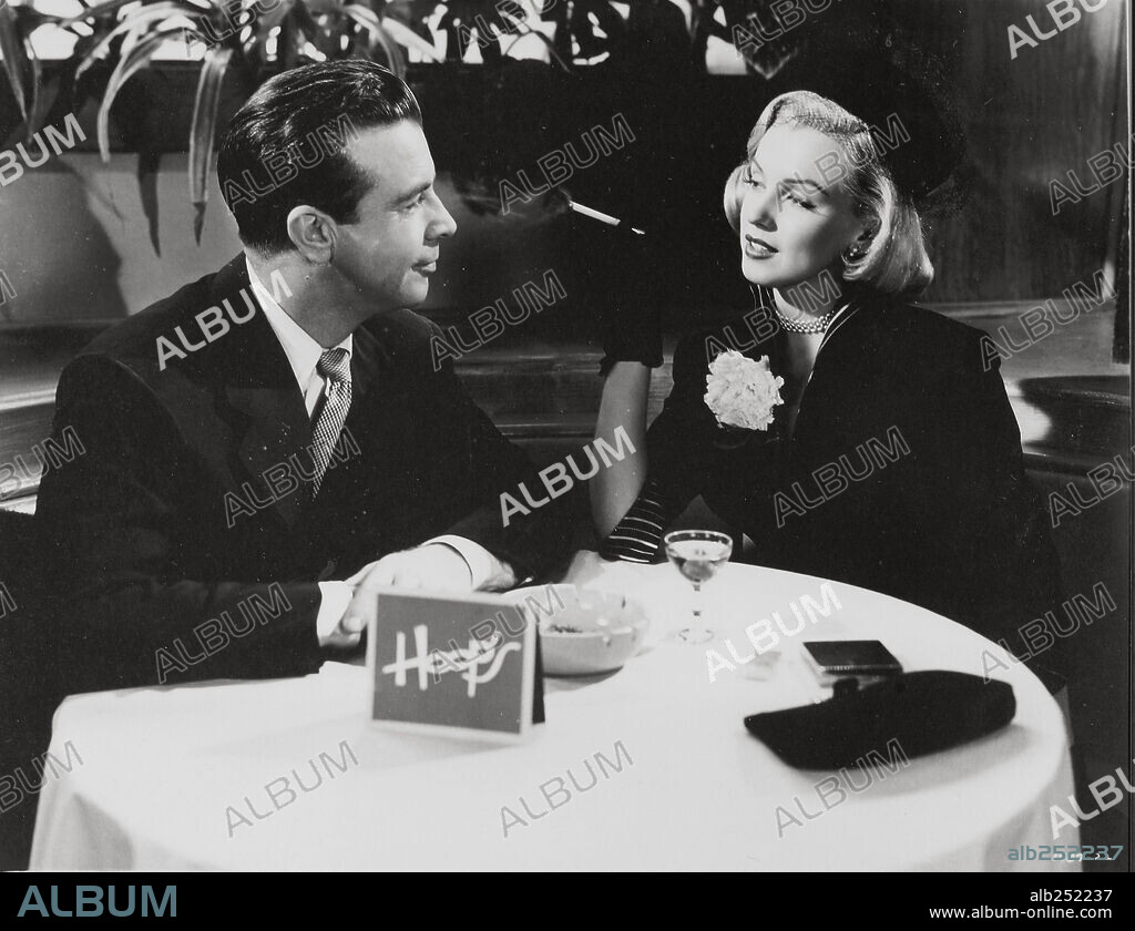 NORMA JEAN BAKER and DICK POWELL. DICK POWELL and MARILYN MONROE in RIGHT CROSS, 1950, directed by JOHN STURGES. Copyright M.G.M.