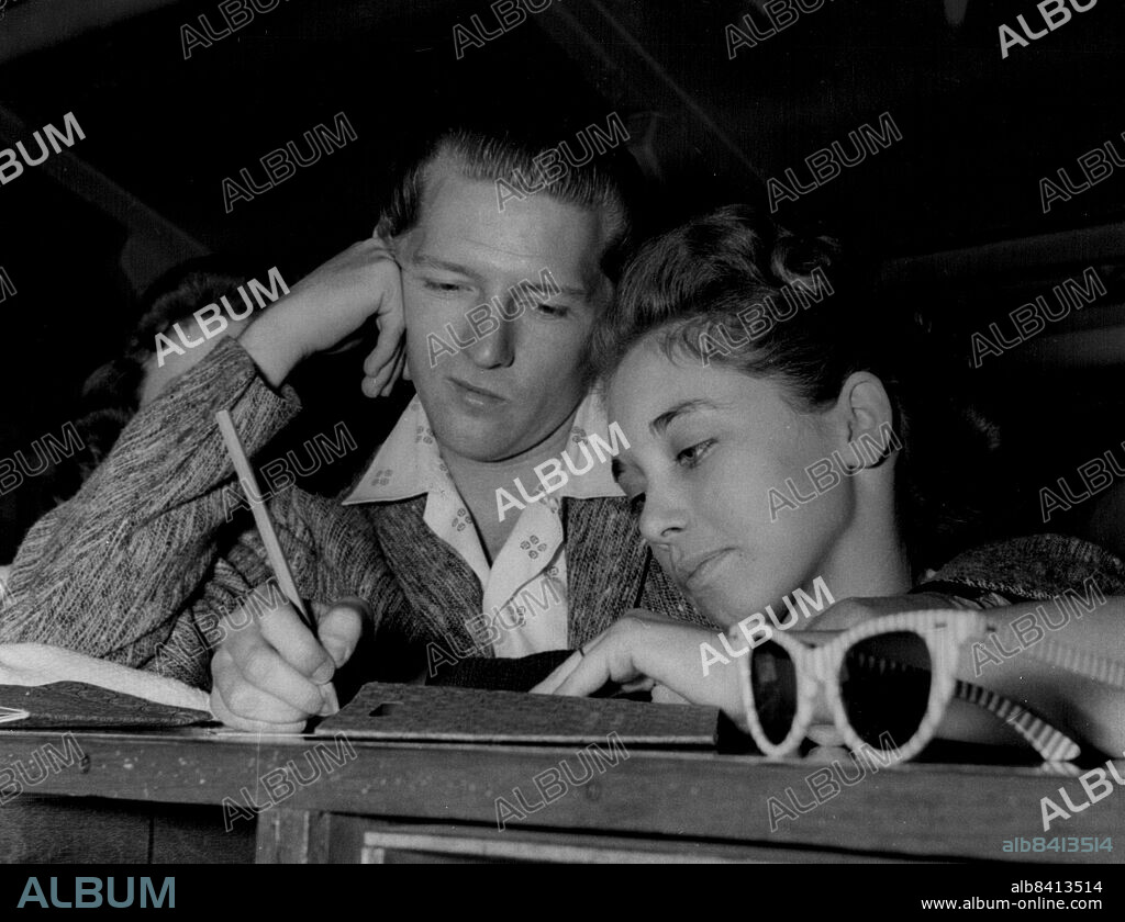 May 27, 1958 - 27-5-58 Singer Jerry Lewis and his child bride â¤ Singer Jerry Lee Lewis may have to cut short his theatrical tour of Britain because of the publicity over his thirteen year old bride. It has been said that the marriage to Myra took place before his divorce from his second wife had been obtained. When he appeared at the Granada, Tooting a crowd of teenagers stood outside the stage doot chanting â¤½We hate Jerry Lewisâ¤, â¤½Baby snatcherâ¤ and â¤½Watch him wheel his wife out in a pramâ¤. Keystone Photo Shows: Myra the thirteen year old wife (Credit Image:.