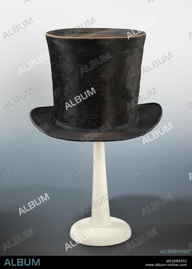 Top hat. Culture: American. Designer: Nash (American). Date: ca. 1850.
The black "topper" quickly became the most common men's hat of the 19th century, evolving with some modifications in height and brim shape from the earliest versions that appeared in the 1800s. Initially appropriate for daily wear, the top hat was reserved for more formal occasions in the late 19th century, a tradition that continues in the 21st century. By the time this hat was made, silk plush had replaced beaver fur as the favored material for hatmakers. Coincidentally, the maker and retailer of this hat, Nash, operated from a shop on Astor Street in Manhattan, named in honor of John Jacob Astor (1763-1848), a man who built his fortune on the demand for beaver fur used to make hats in the late 18th century  and early 19th century.